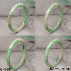 Very small white base with splotches green jade bangle