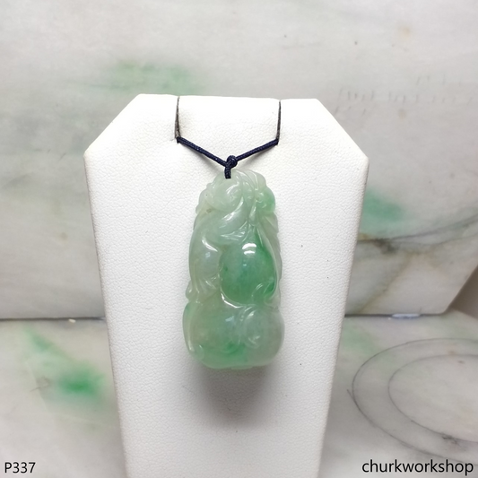 Light green carved jade pendant.