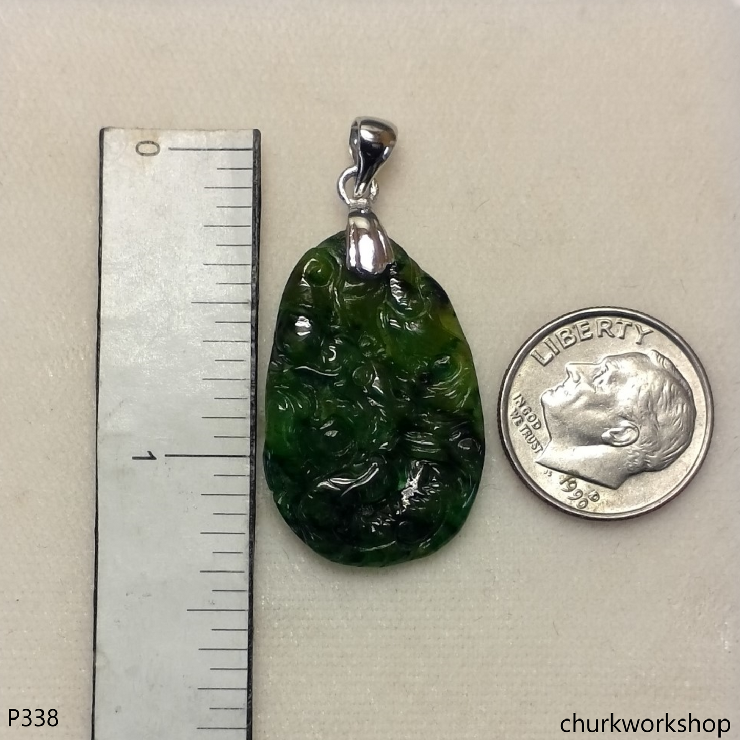 Dark green jade dragon pendant