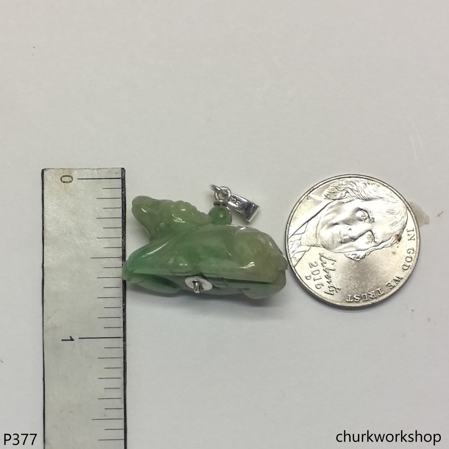 Green jade Ox pendant with silver bail