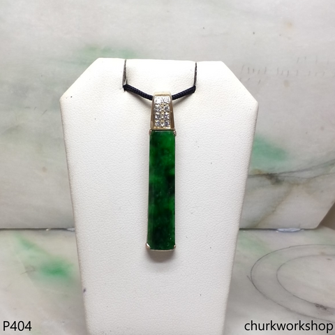 Deep green rectangular jade pendant in 14k gold