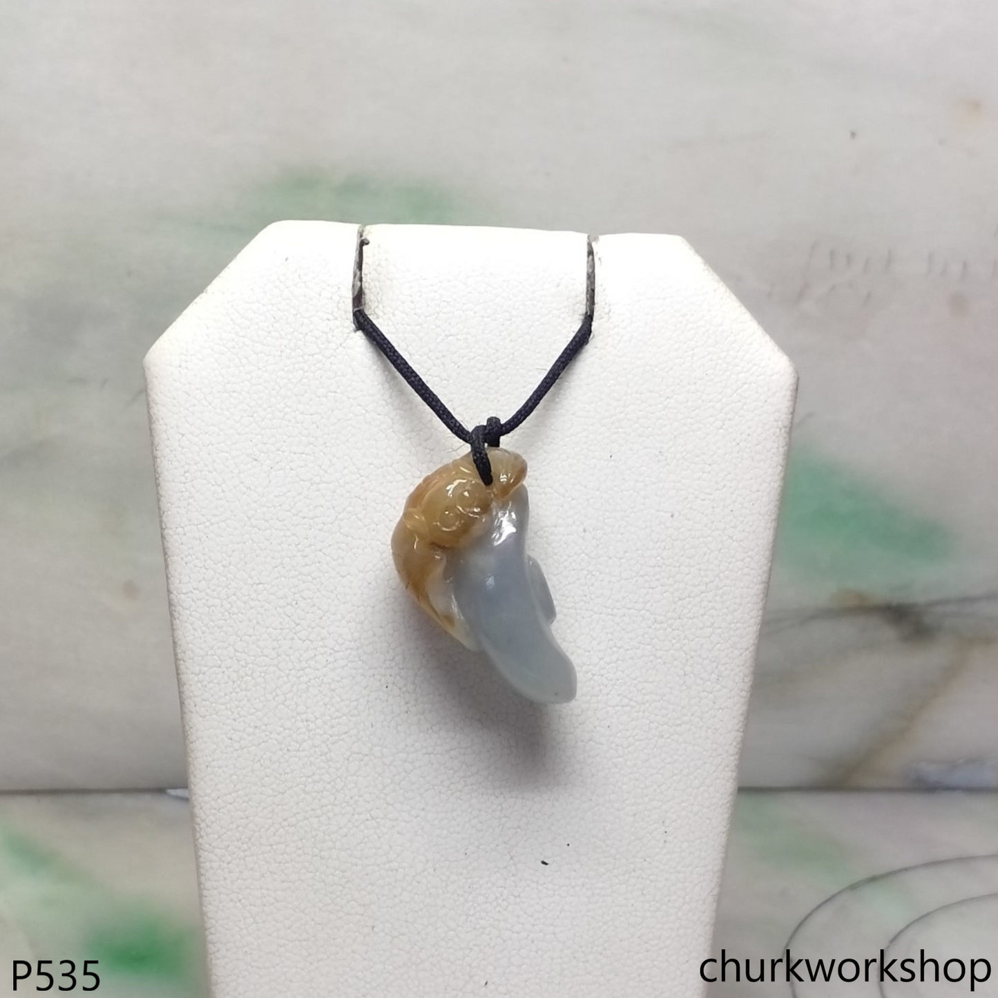 Yellow and bluish green jade bat pendant