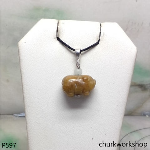 Red jade pig pendant with silver bail