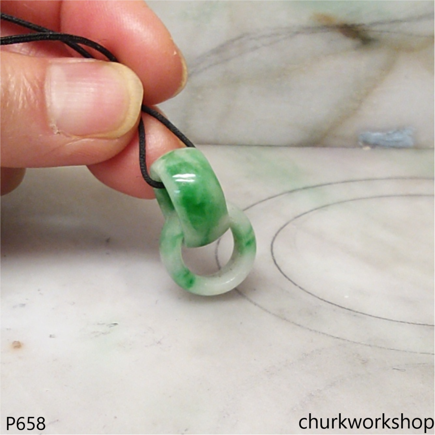 Interlocking jade ring pendant