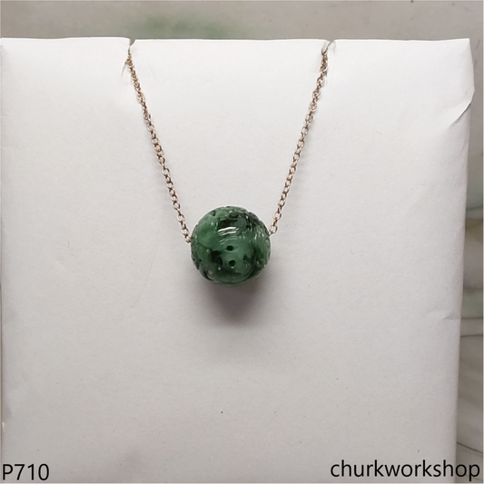 Carved green jade bead pendant