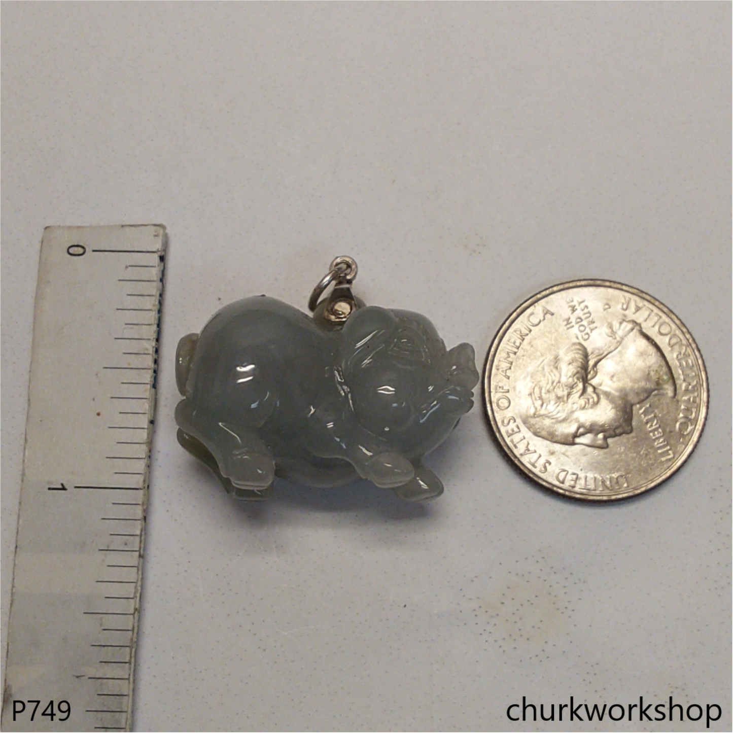 Grayish lavender jade pig with silver bail.