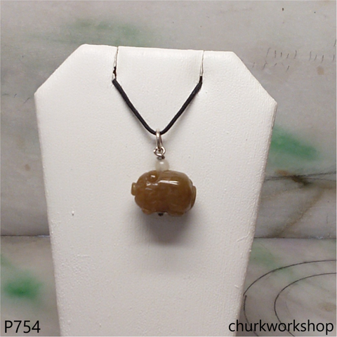 Red jade pig pendant with silver bail