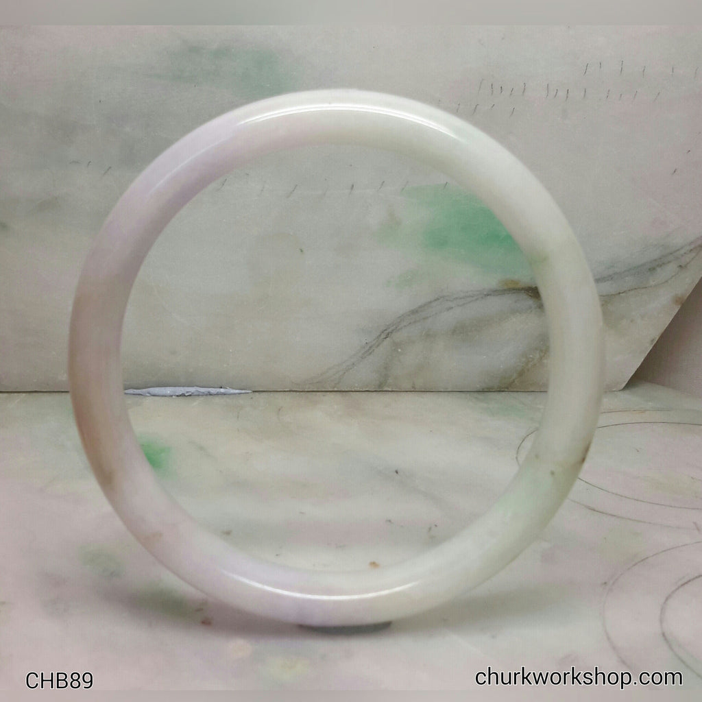 Large pale lavender jade bangle with splotches apple green
