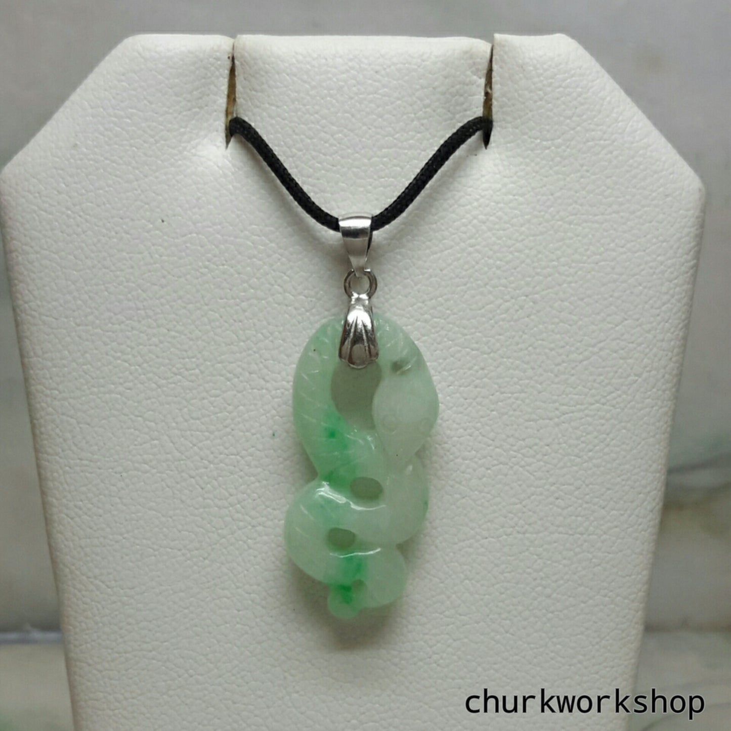 Natural color jade snake pendant.
