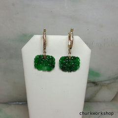 Green carved jade earrings