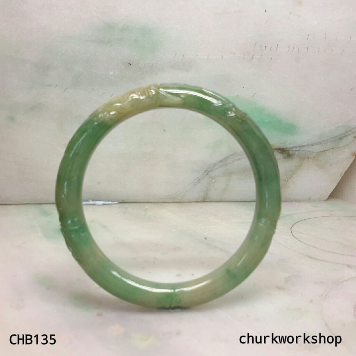 Small carved green jade bangle