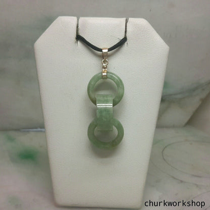 Triple ring pale green jade pendant