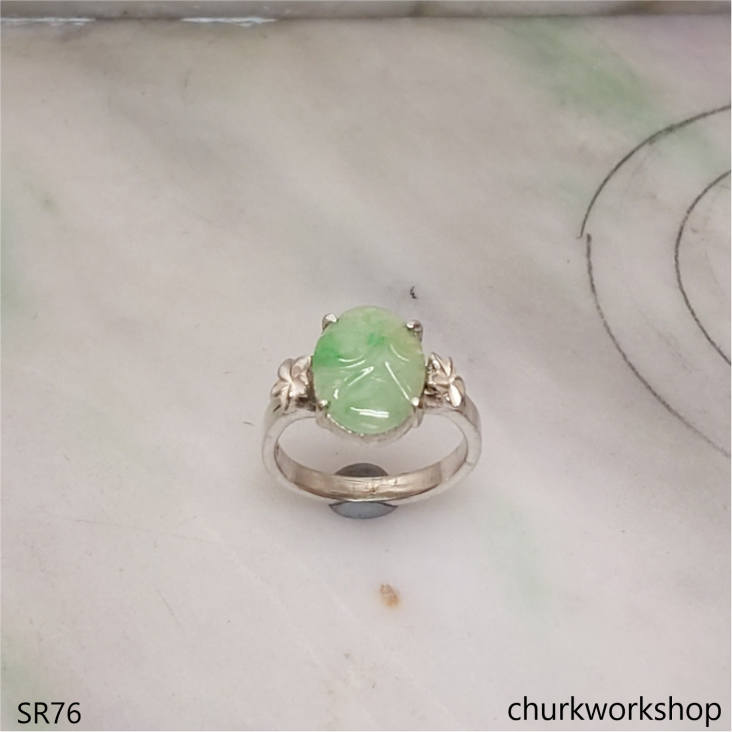 Light green carved jade ring