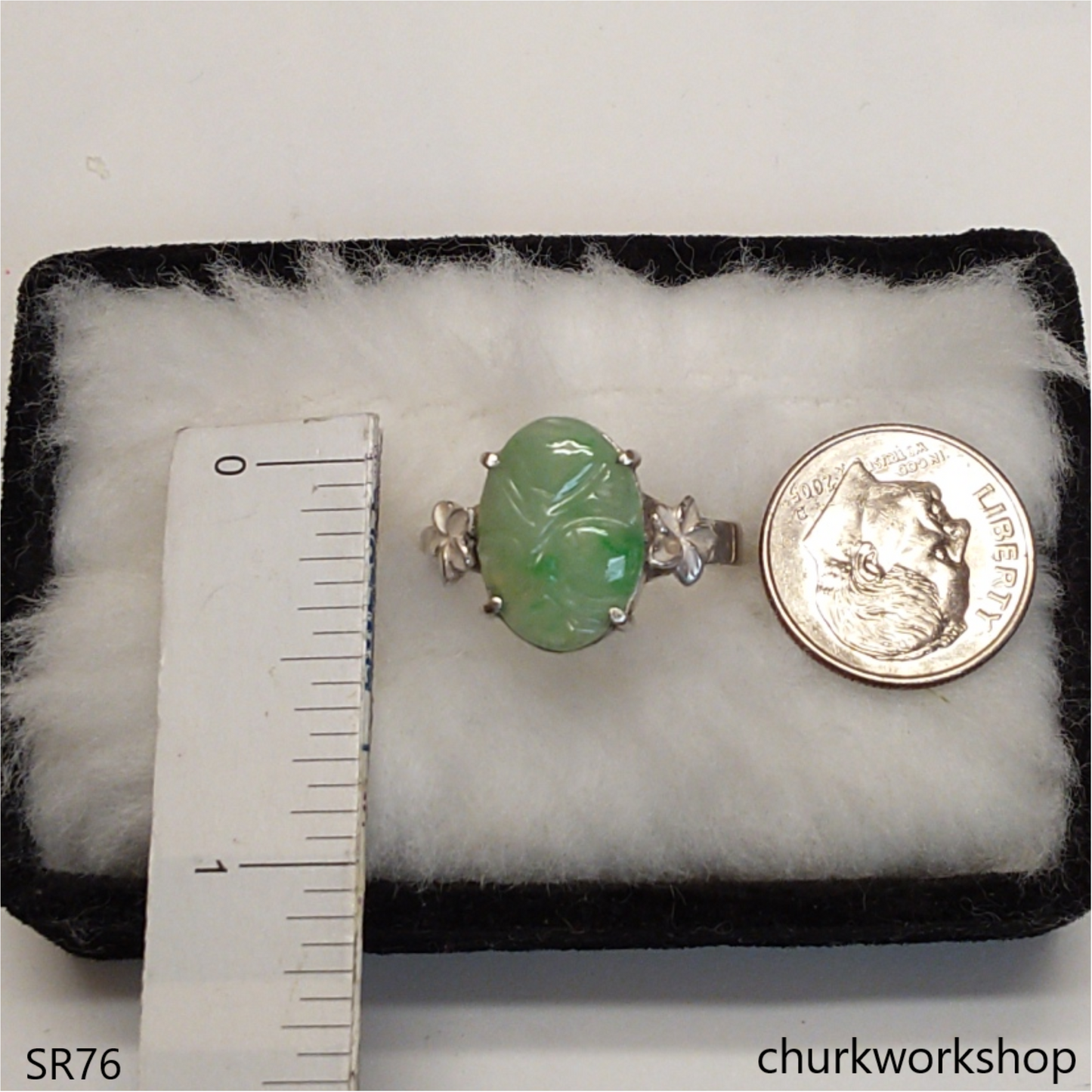 Light green carved jade ring